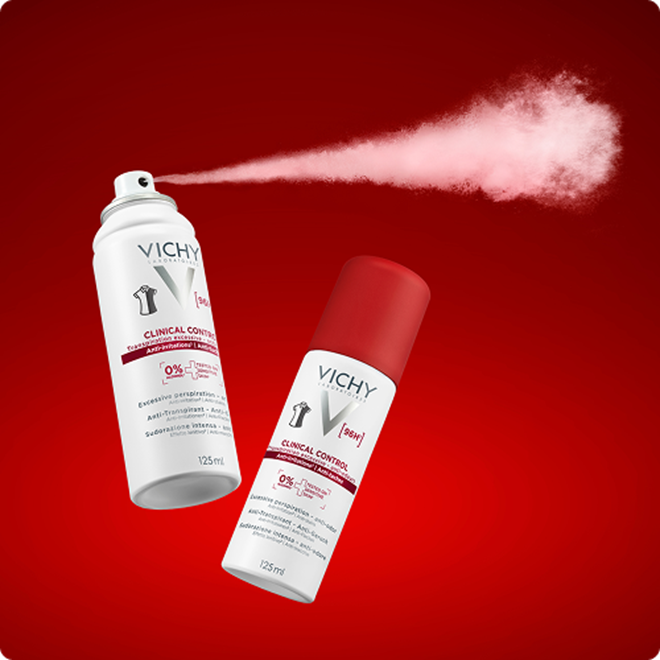 Vichy Clinical Control Deodorant-Produkte mit rosa Sprühwolke vor rotem Hintergrund
