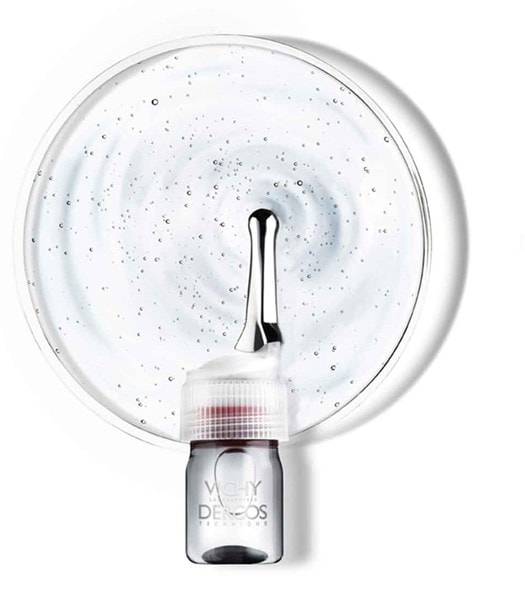 Produktflasche mit Aufsatz und Textur im Hintergrund