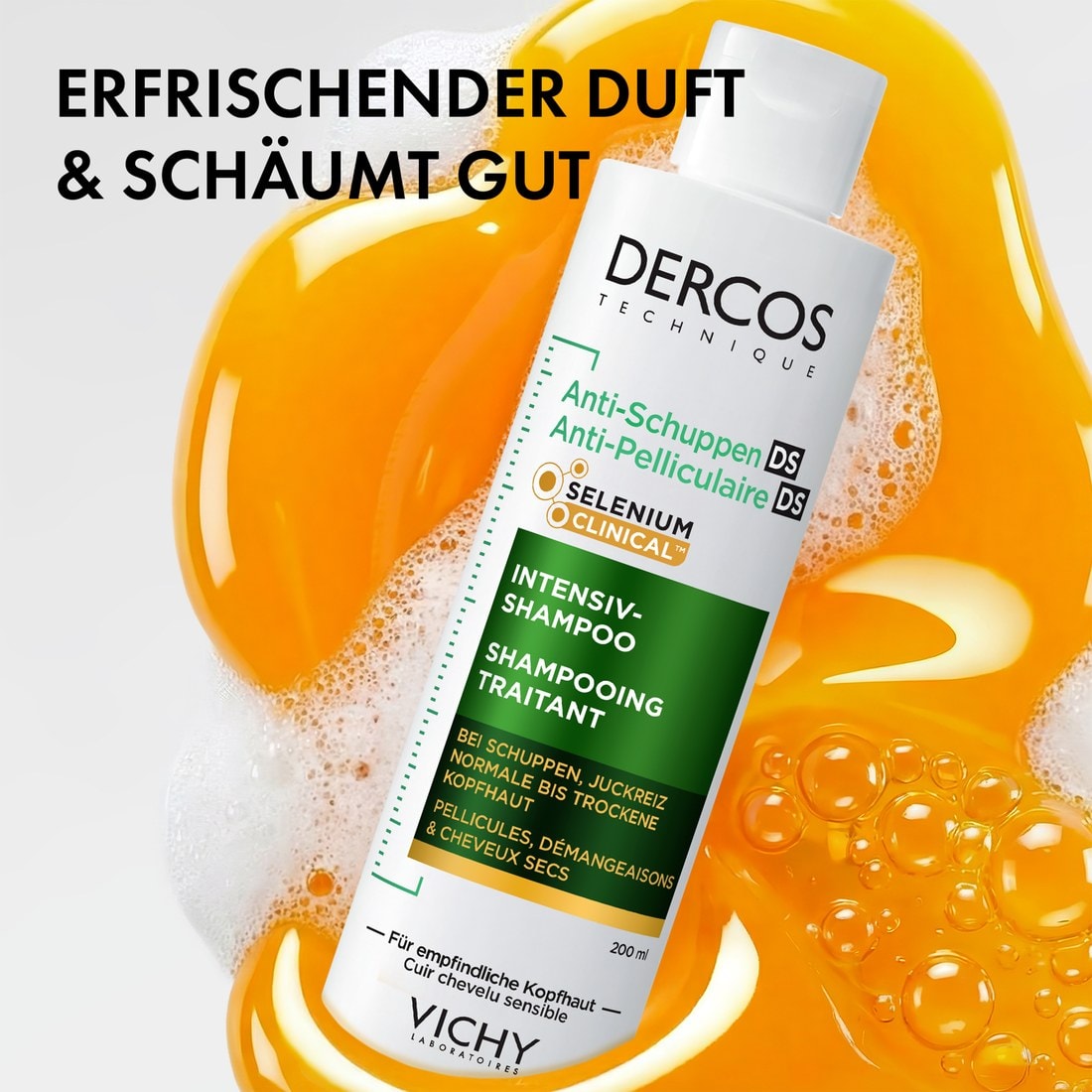 Vichy Dercos Anti-Schuppen Intensiv-Shampoo 200 ml vor gelber Shampoo-Textur und Schaum. Erfrischender Duft, schäumt gut.